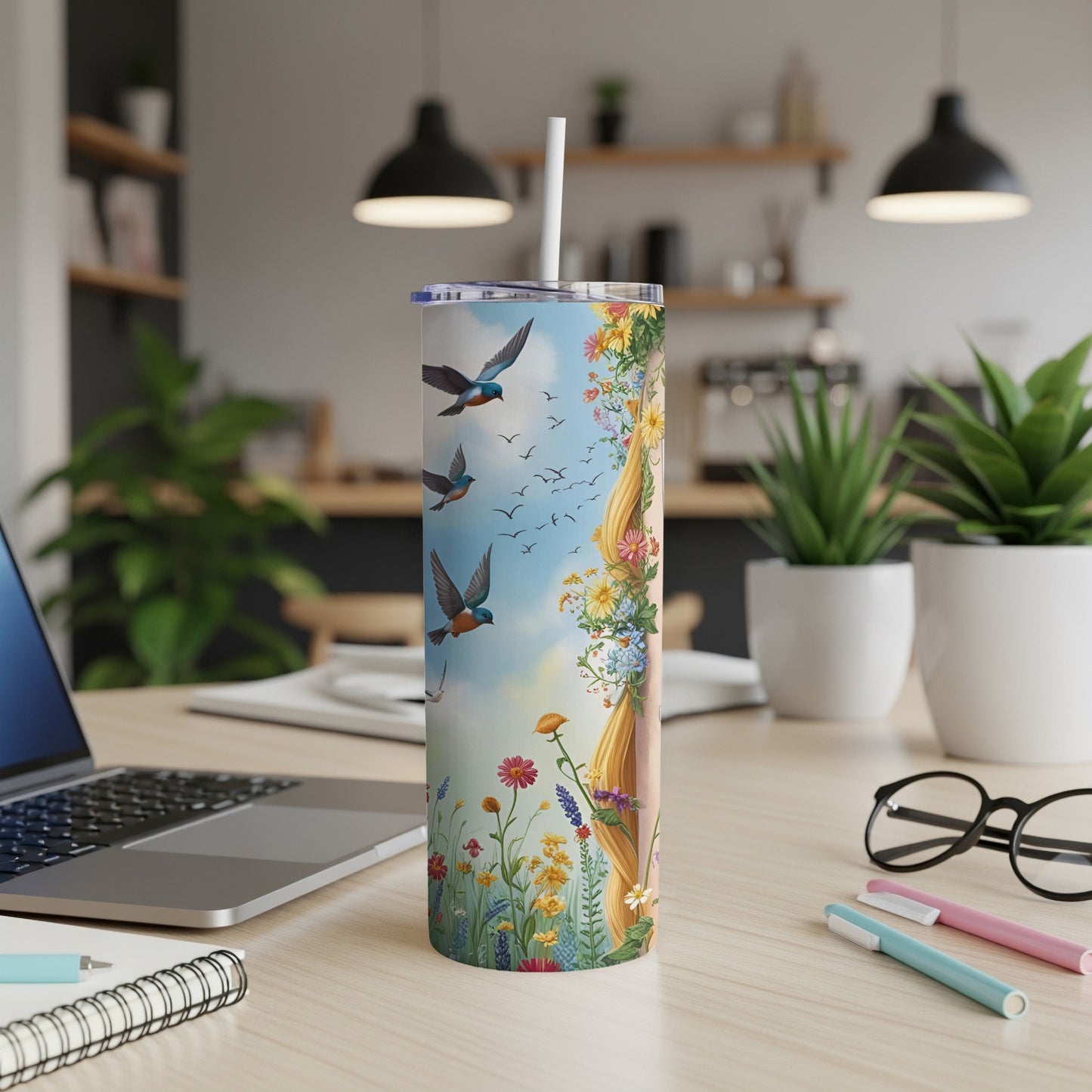 Tall tumbler with Rapunzel illustration and birds flying over a meadow.