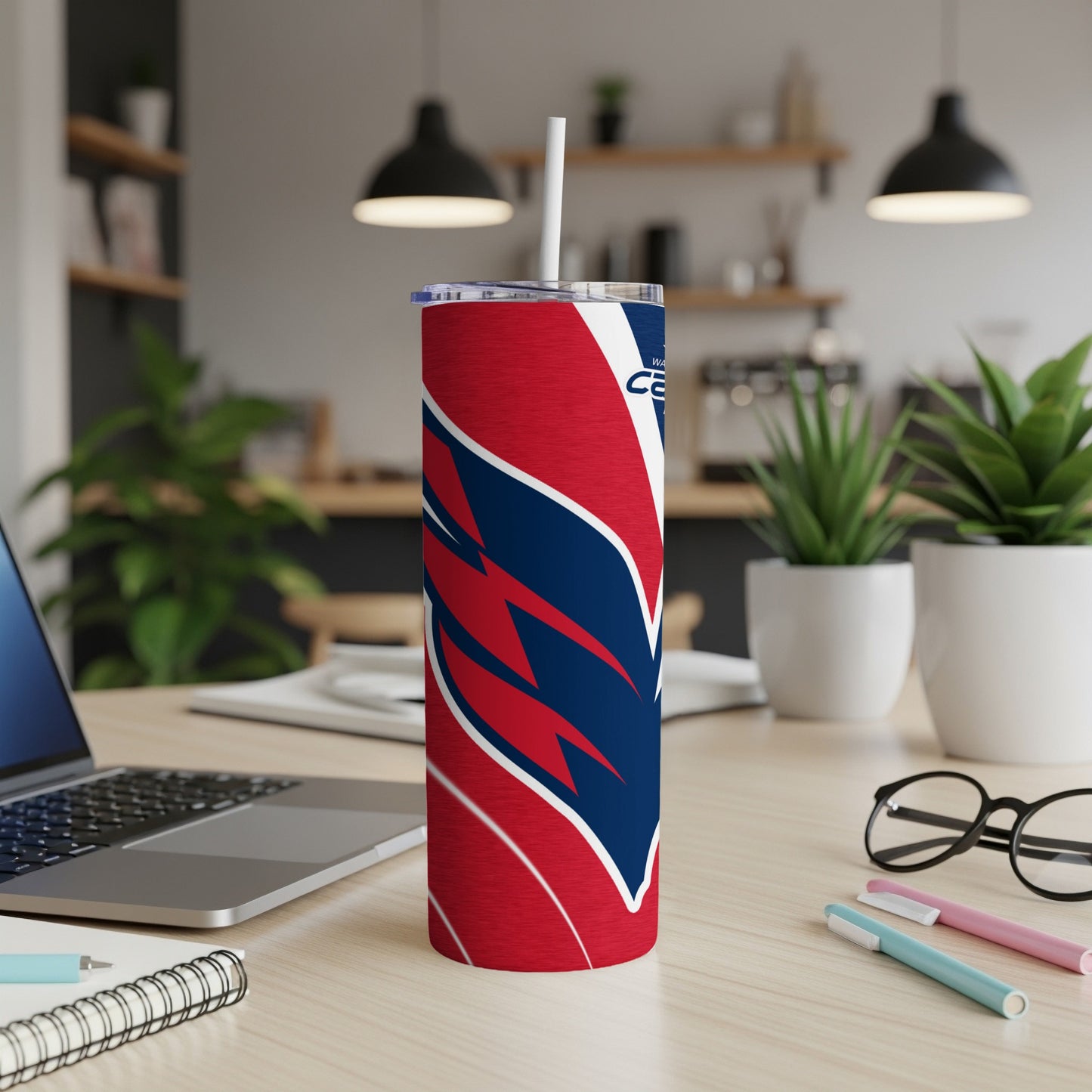 Washington Capitals tumbler with red, white, and blue logo and straw.