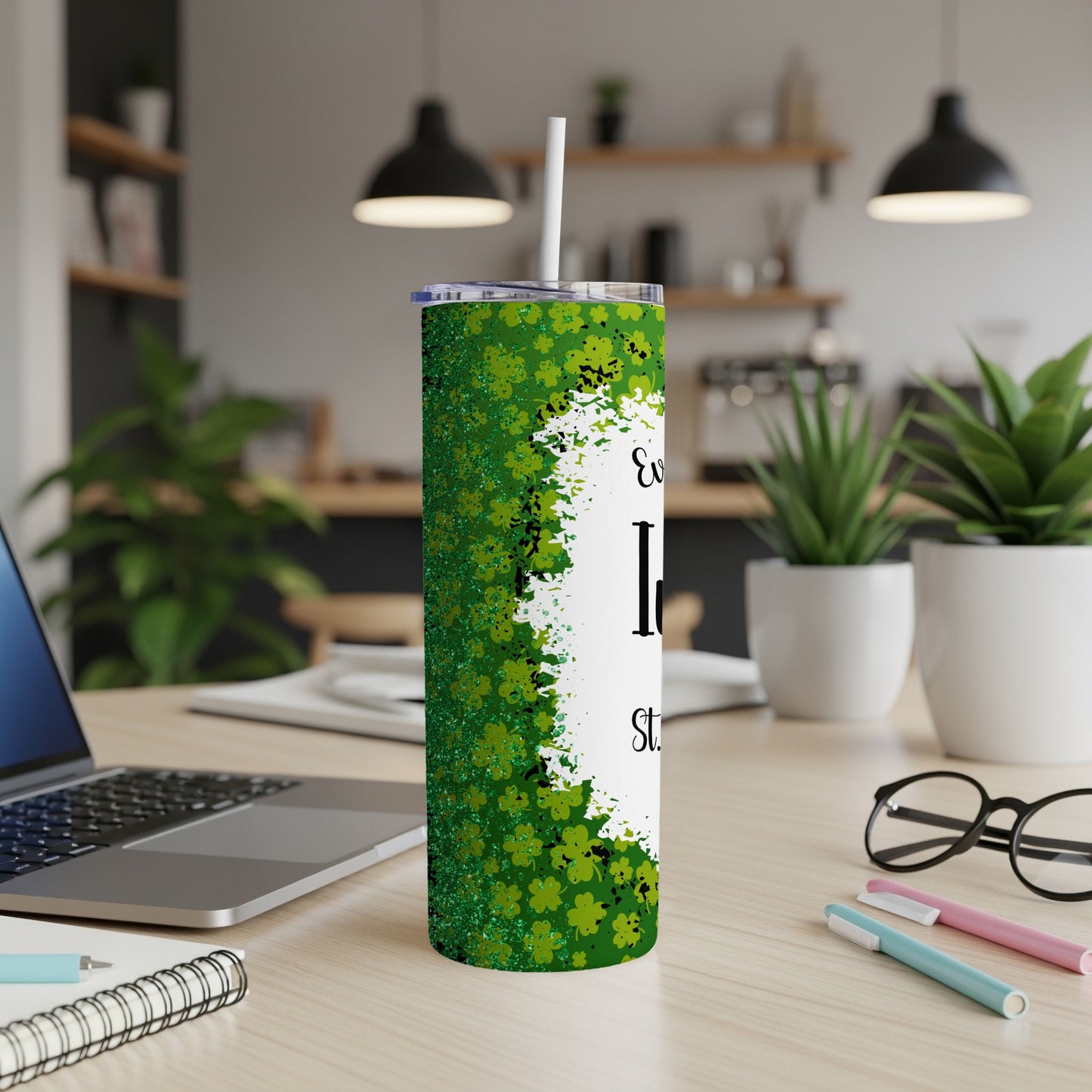 Green glitter shamrock tumbler with straw and white text.