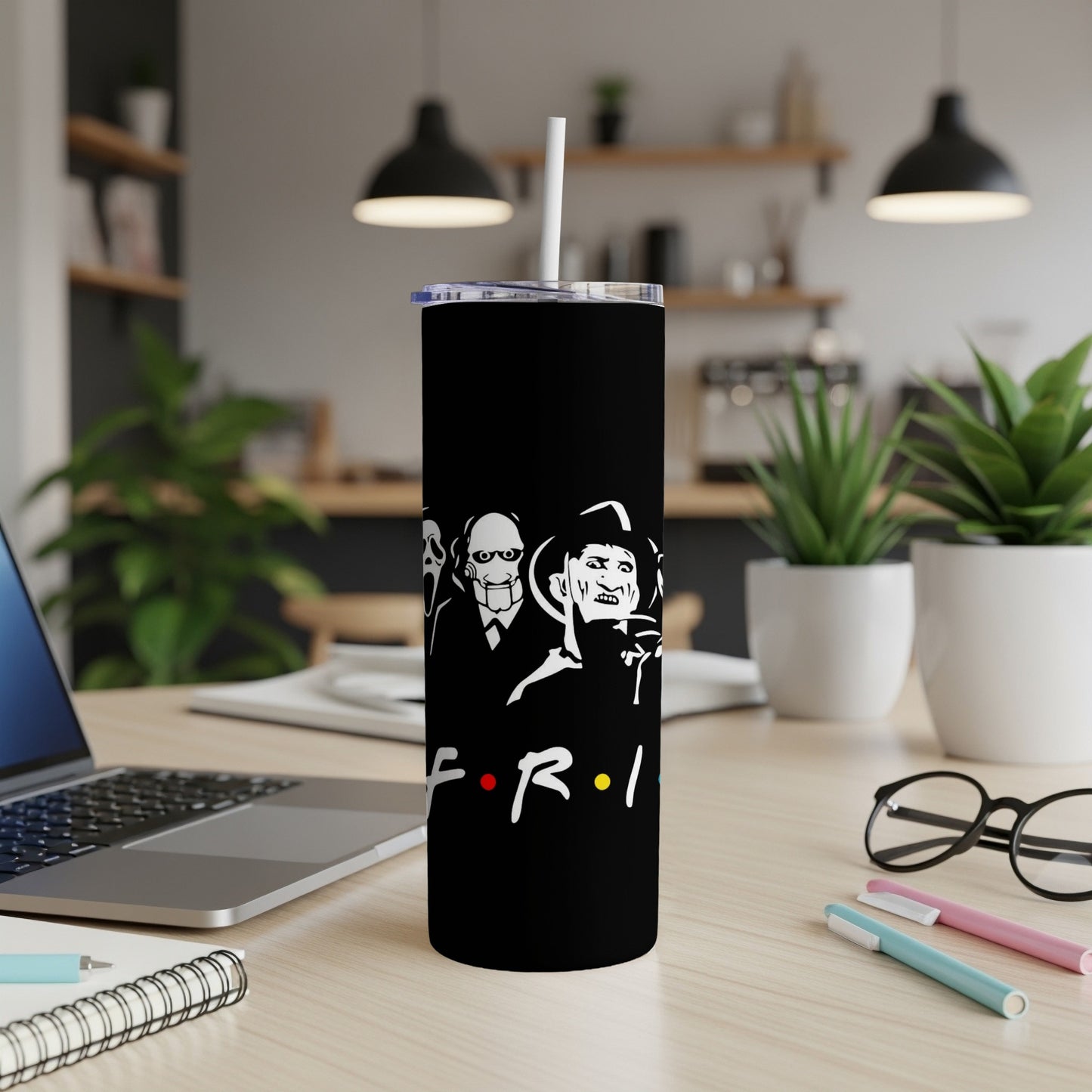 Black tumbler with horror characters and Friends-style logo.