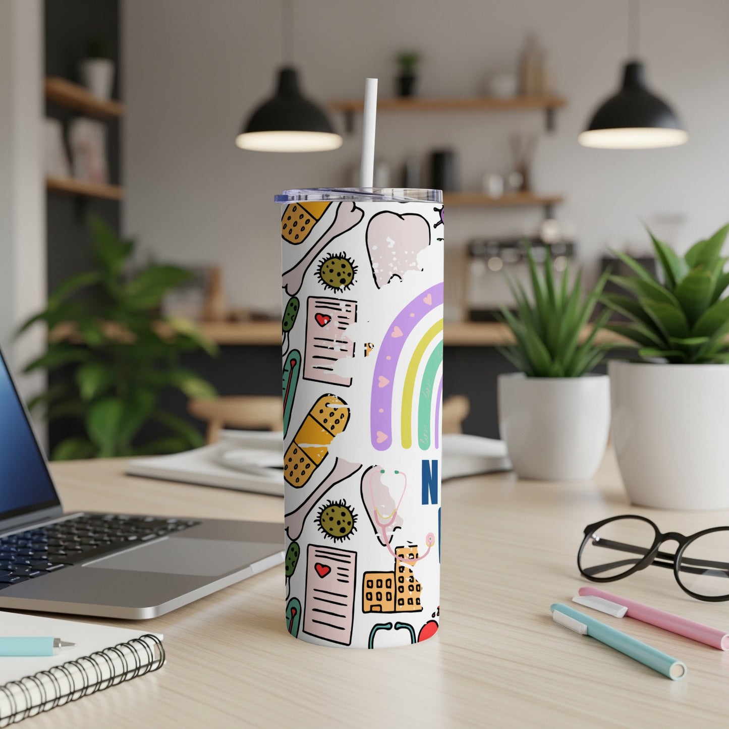 Tumbler with medical icons and rainbow.