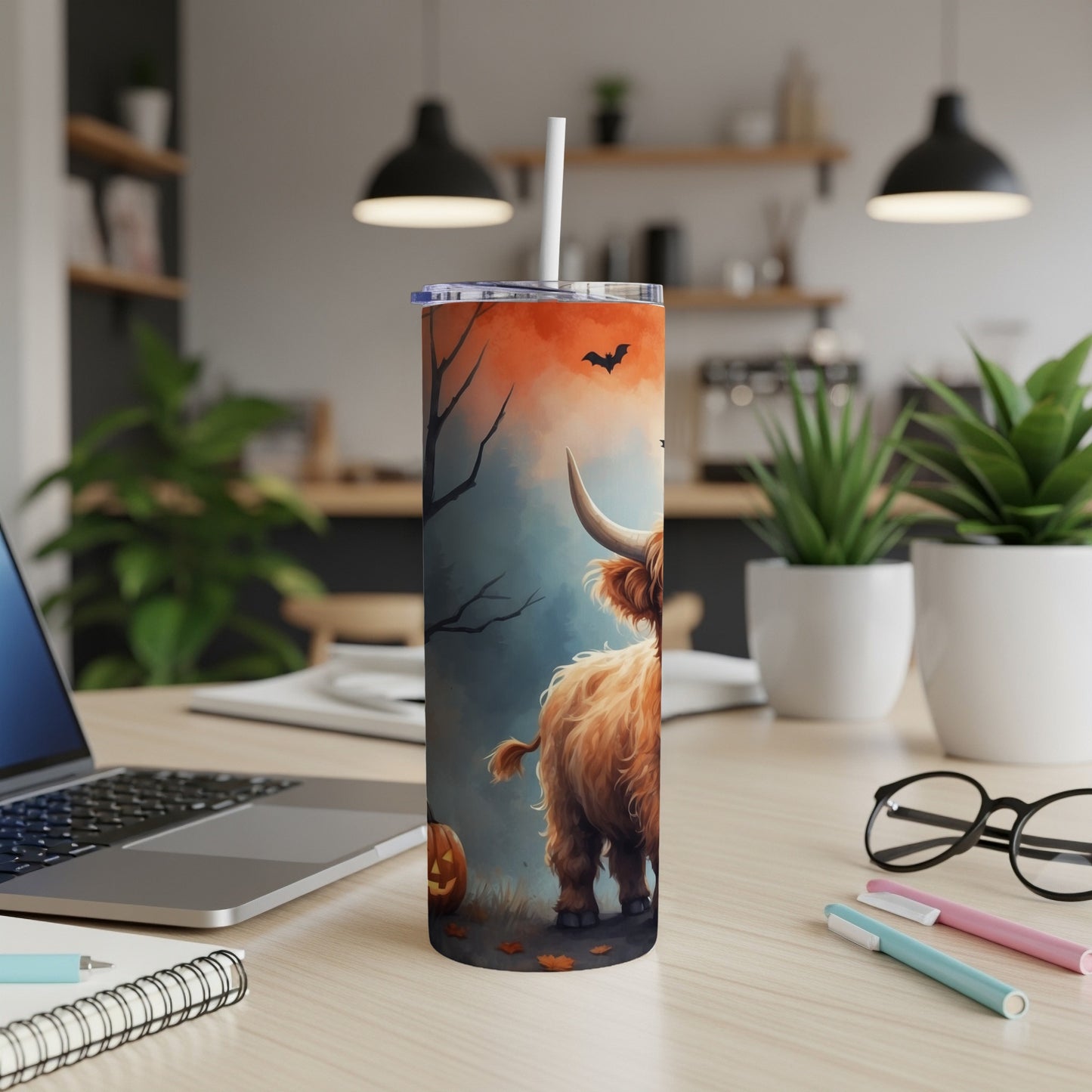 Highland cow with Halloween theme on a skinny tumbler.
