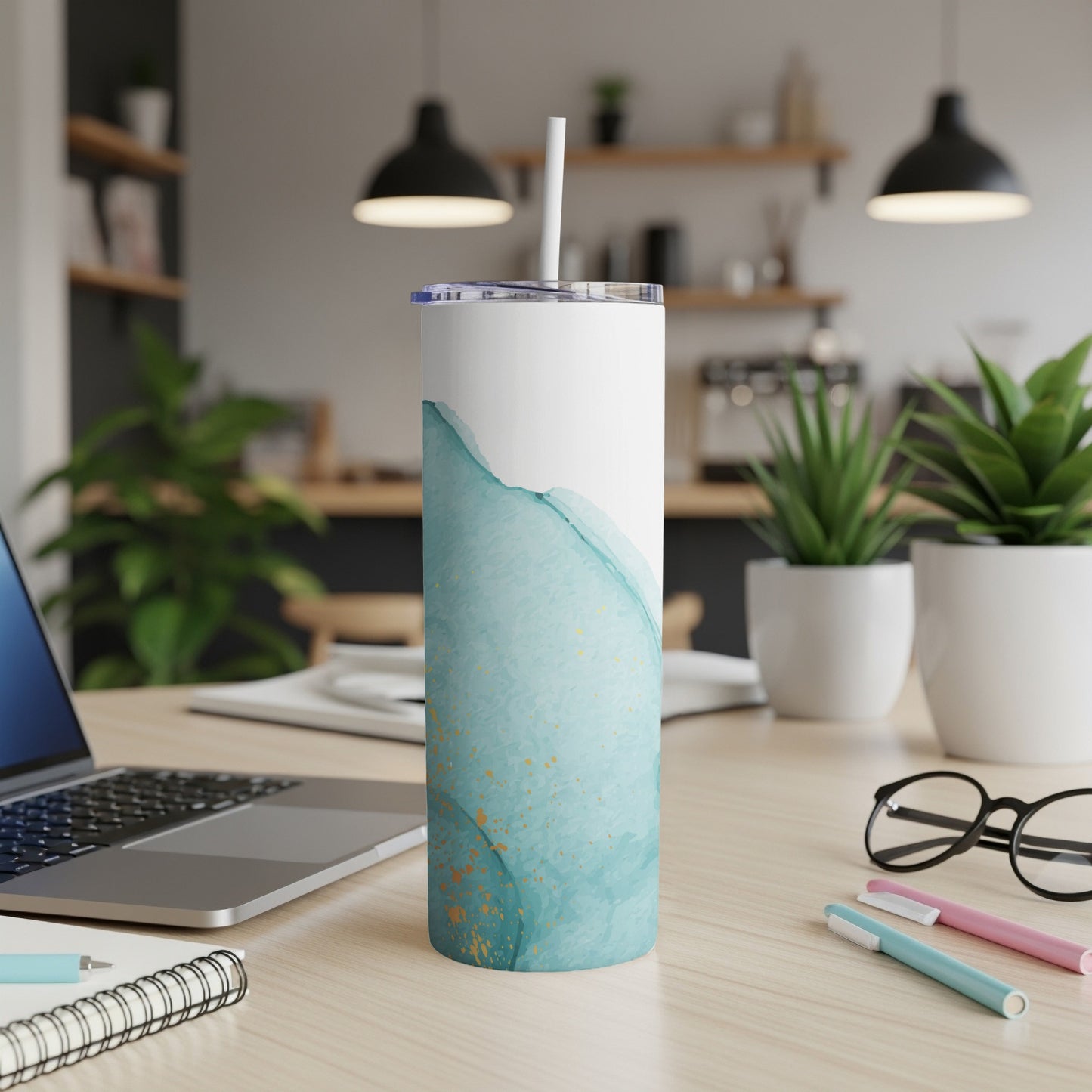 Tall white tumbler with watercolor splash design and gold flecks.