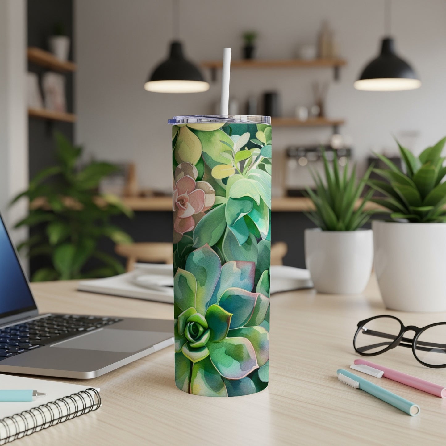 Tumbler with a watercolor succulent and floral design.