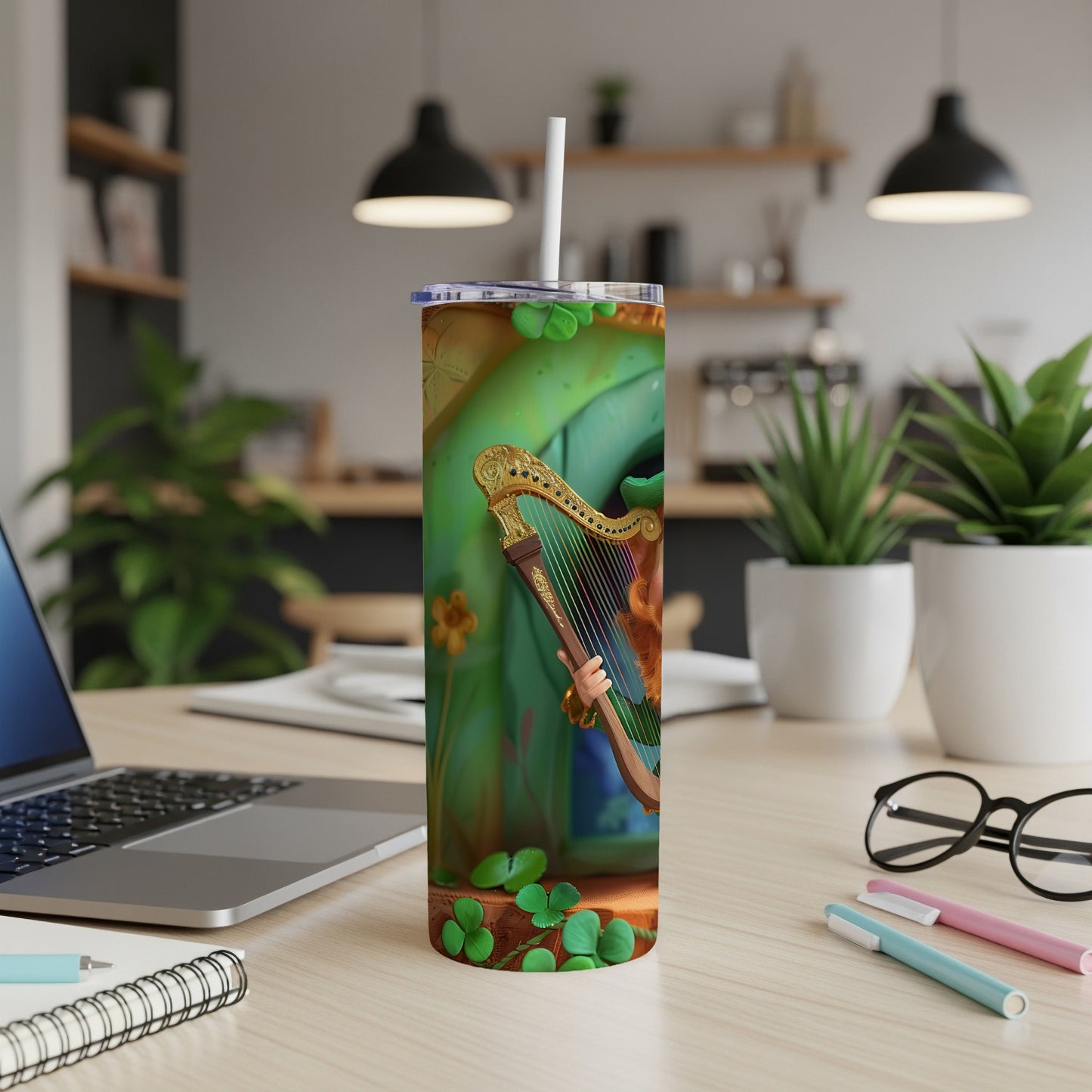 Green tumbler featuring a stylized Irish harp with a woman's hand playing it.