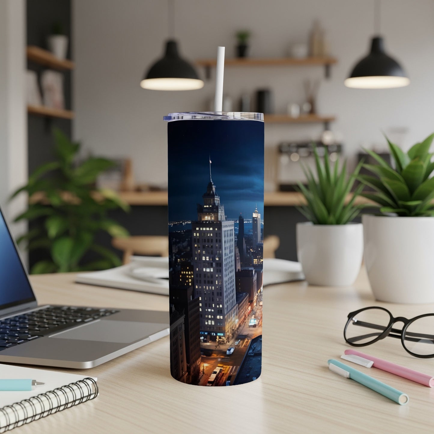 Tall tumbler with nighttime city skyline and skyscrapers.