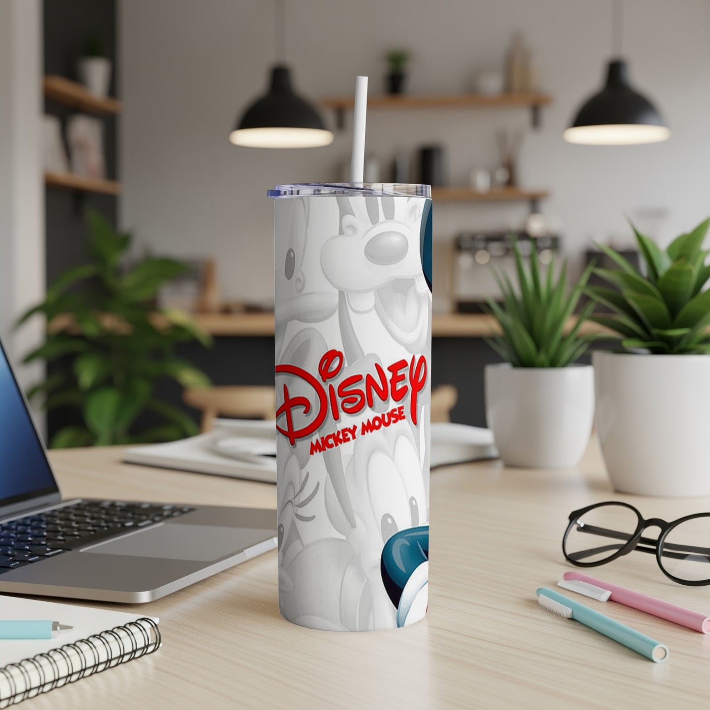 White tumbler with repeating Mickey Mouse pattern and logo.