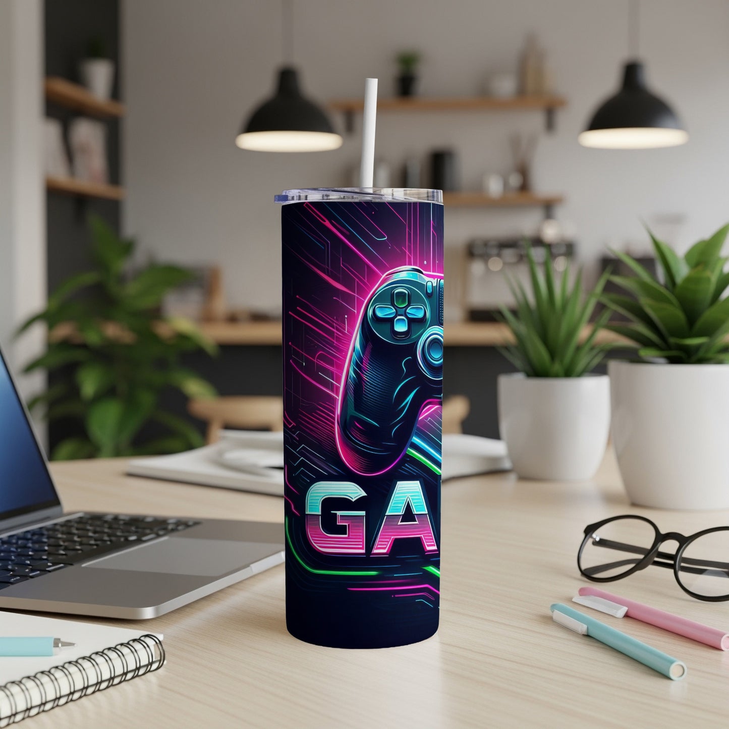 Gaming controller design on a skinny tumbler with a straw.