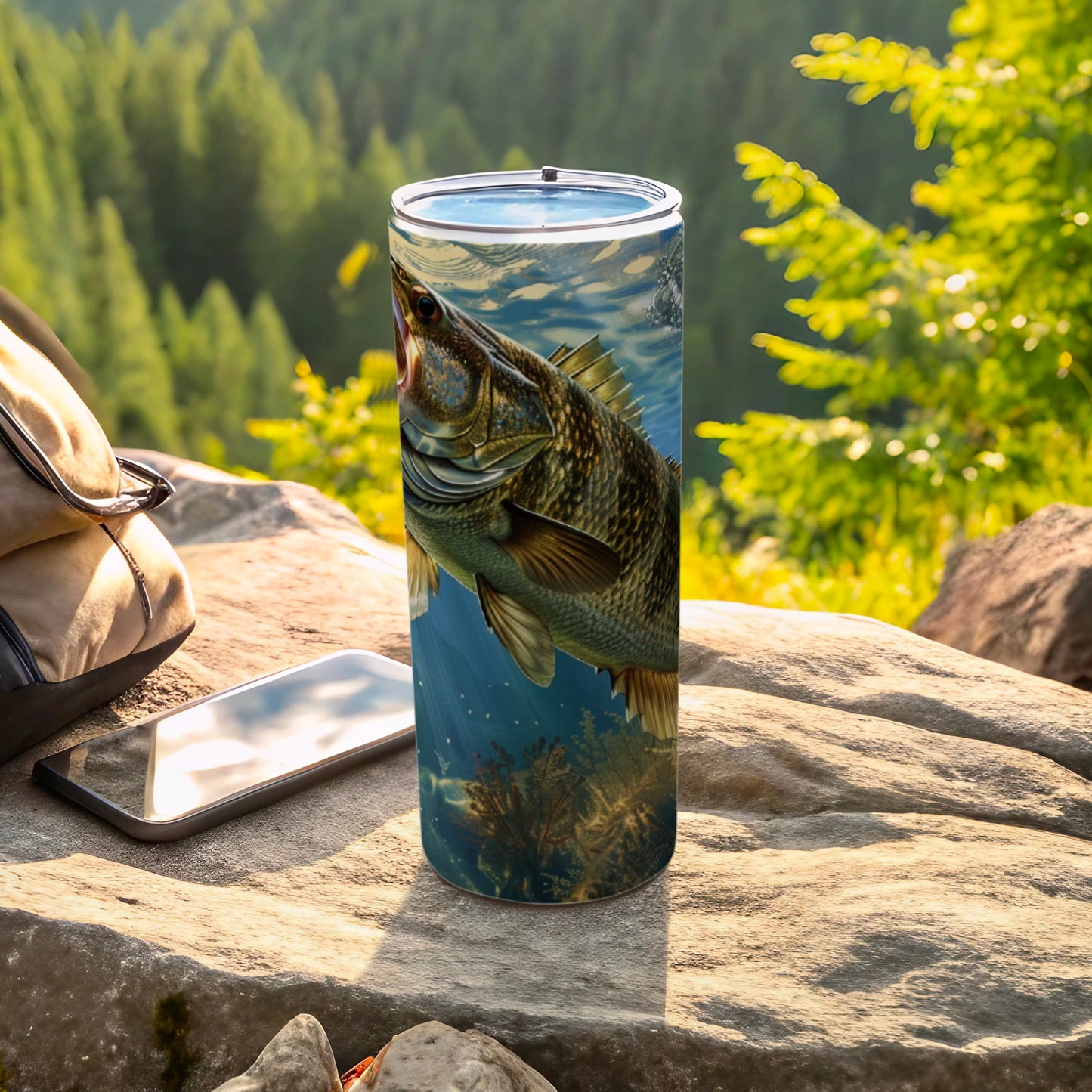 Fish swimming underwater, printed on a metal tumbler next to a phone and backpack.
