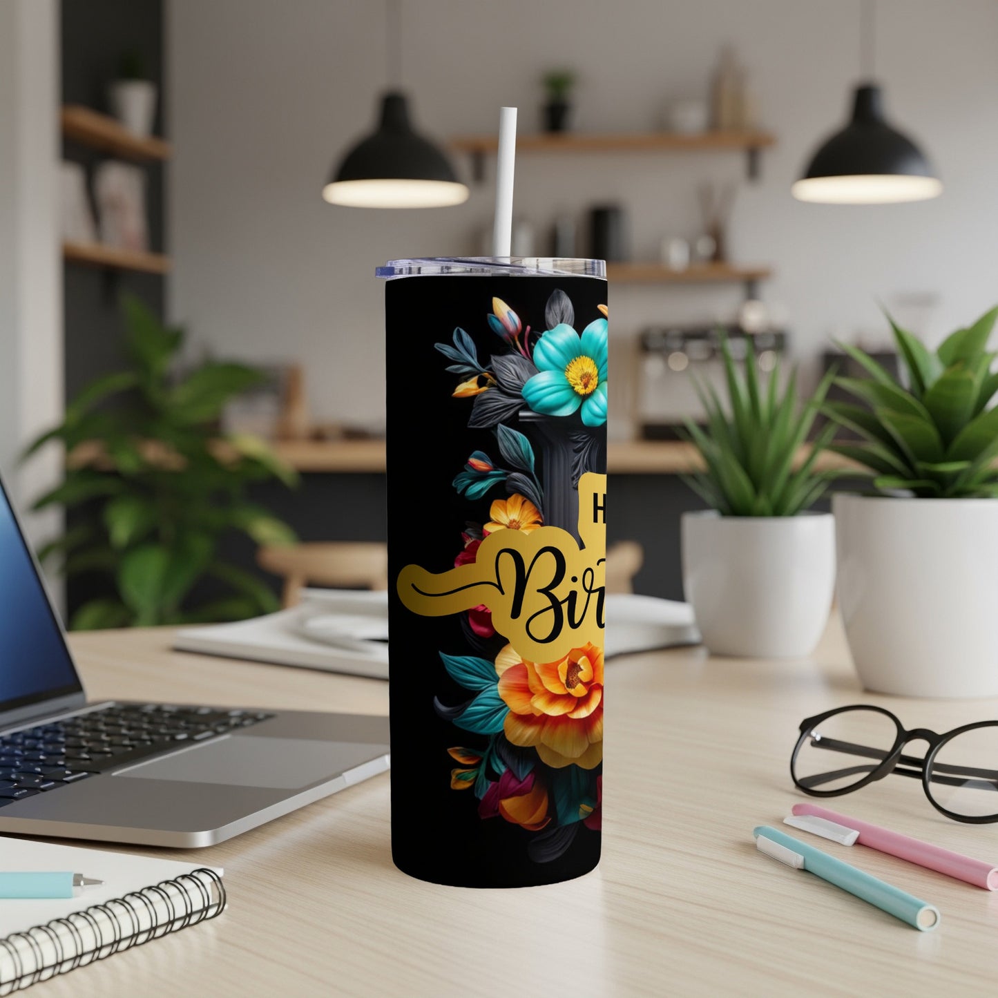 Black tumbler with "Happy Birthday" text and colorful floral accents.