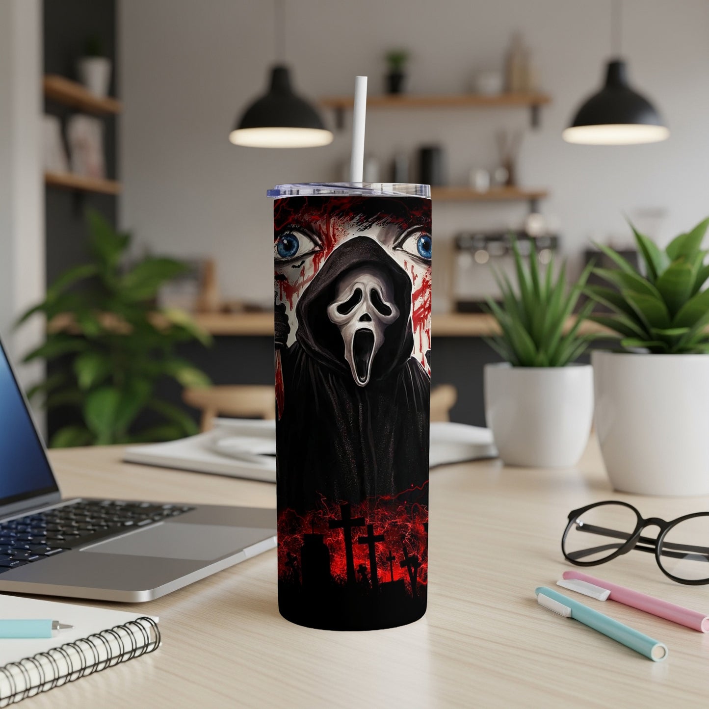 Ghostface mask with bloody eyes on a black tumbler with cemetery background.