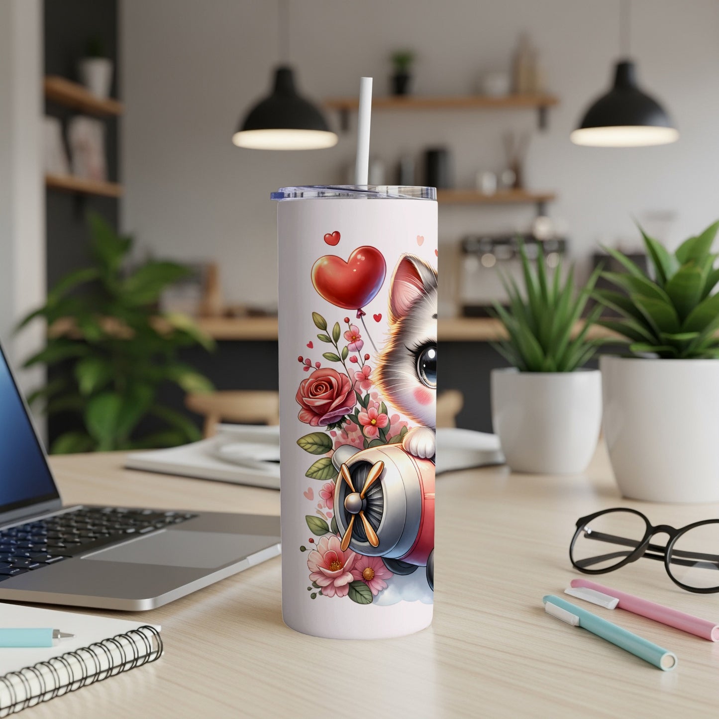 Cartoon cat in airplane with balloons and flowers on a skinny tumbler.
