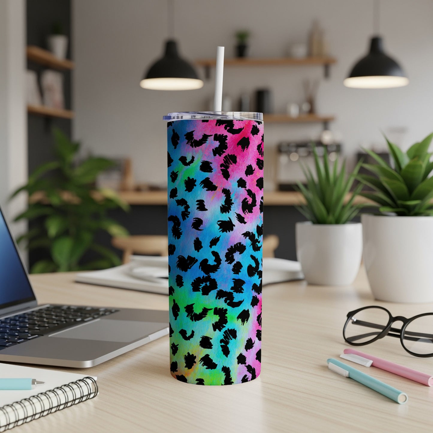 Tumbler with colorful tie-dye and black leopard print; includes straw.