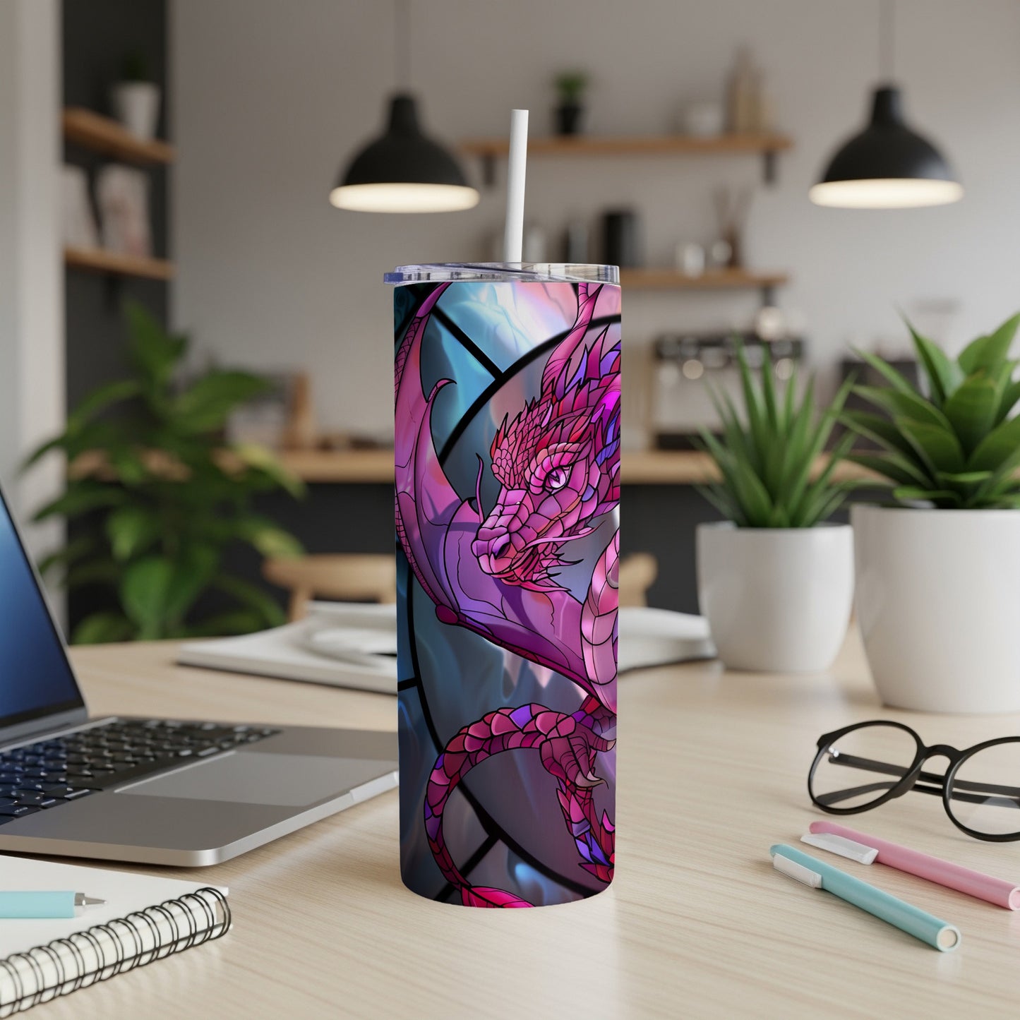 Purple dragon design on a white tumbler with a straw.
