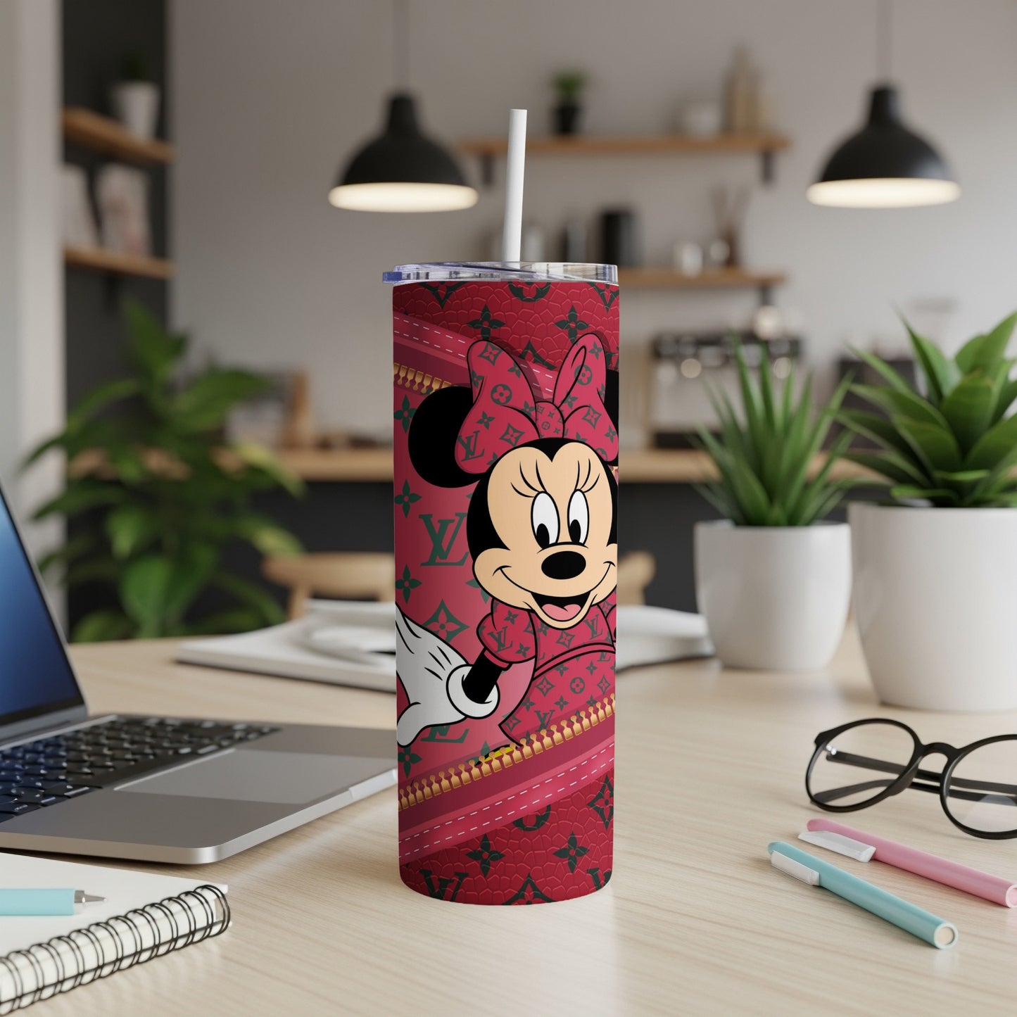 Minnie Mouse on a red tumbler with a zipper pattern.
