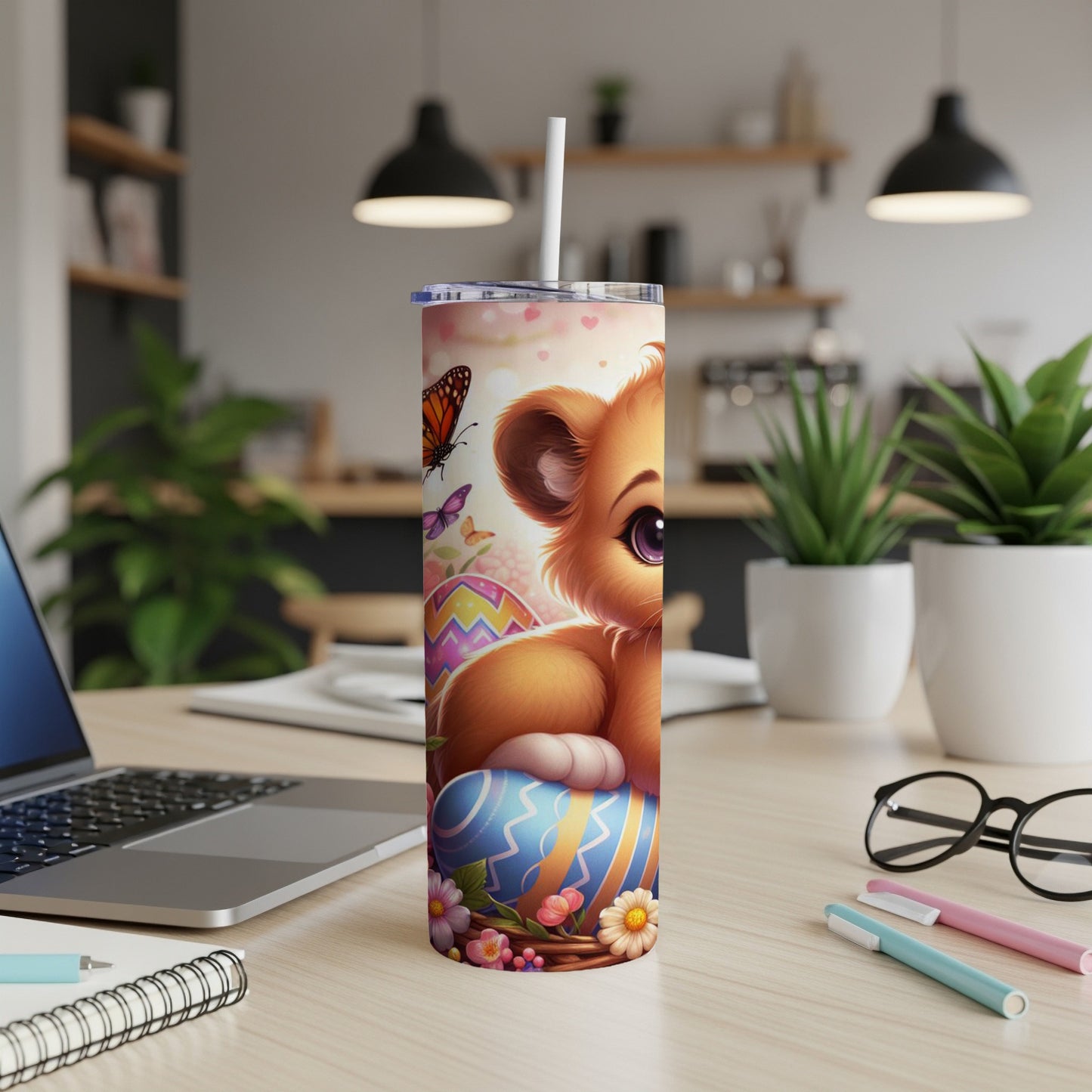 Cute cartoon lion cub with Easter eggs and butterflies on a tumbler.