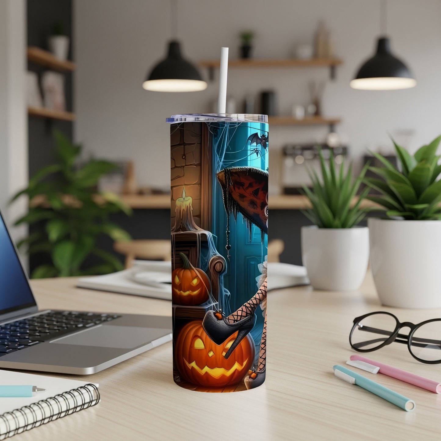 Halloween tumbler with pumpkins, bats, and a witch's leg.