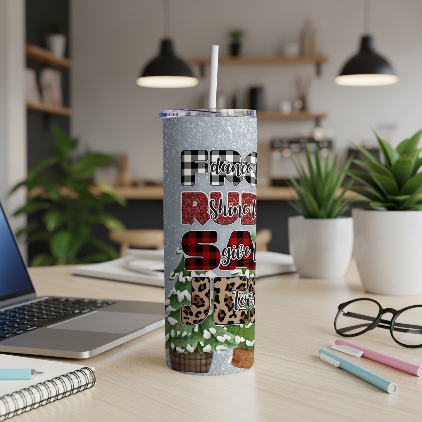 Silver tumbler with "Merry and Bright" text and buffalo plaid Christmas tree design.