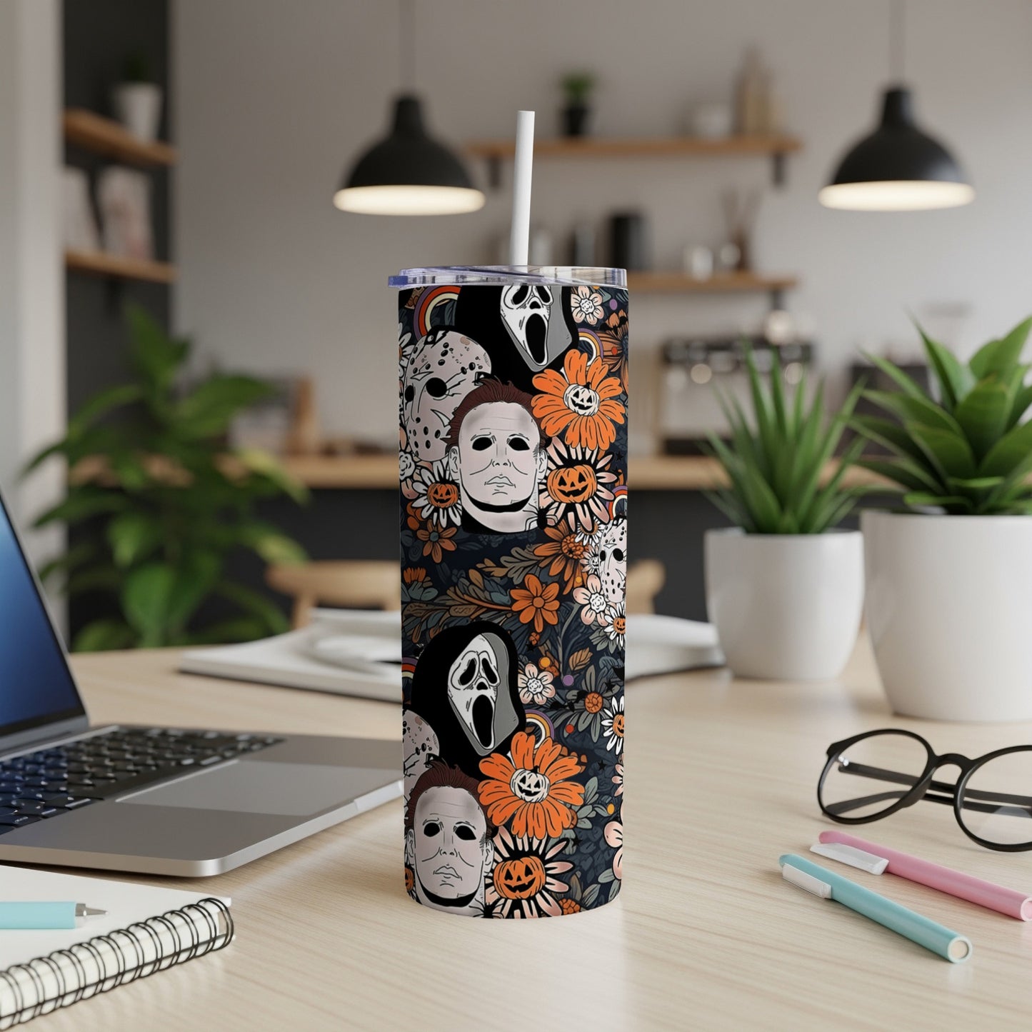 Tumbler with horror characters and floral pattern, featuring Michael Myers and Ghostface.