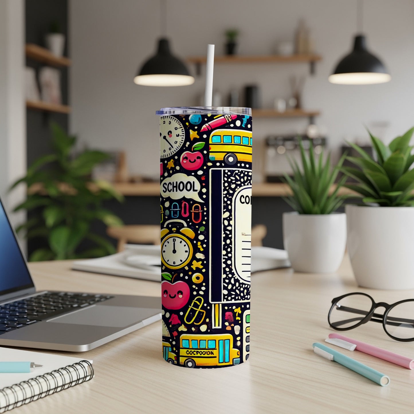 Tumbler with school-themed design featuring apples, buses, clocks, and pencils.