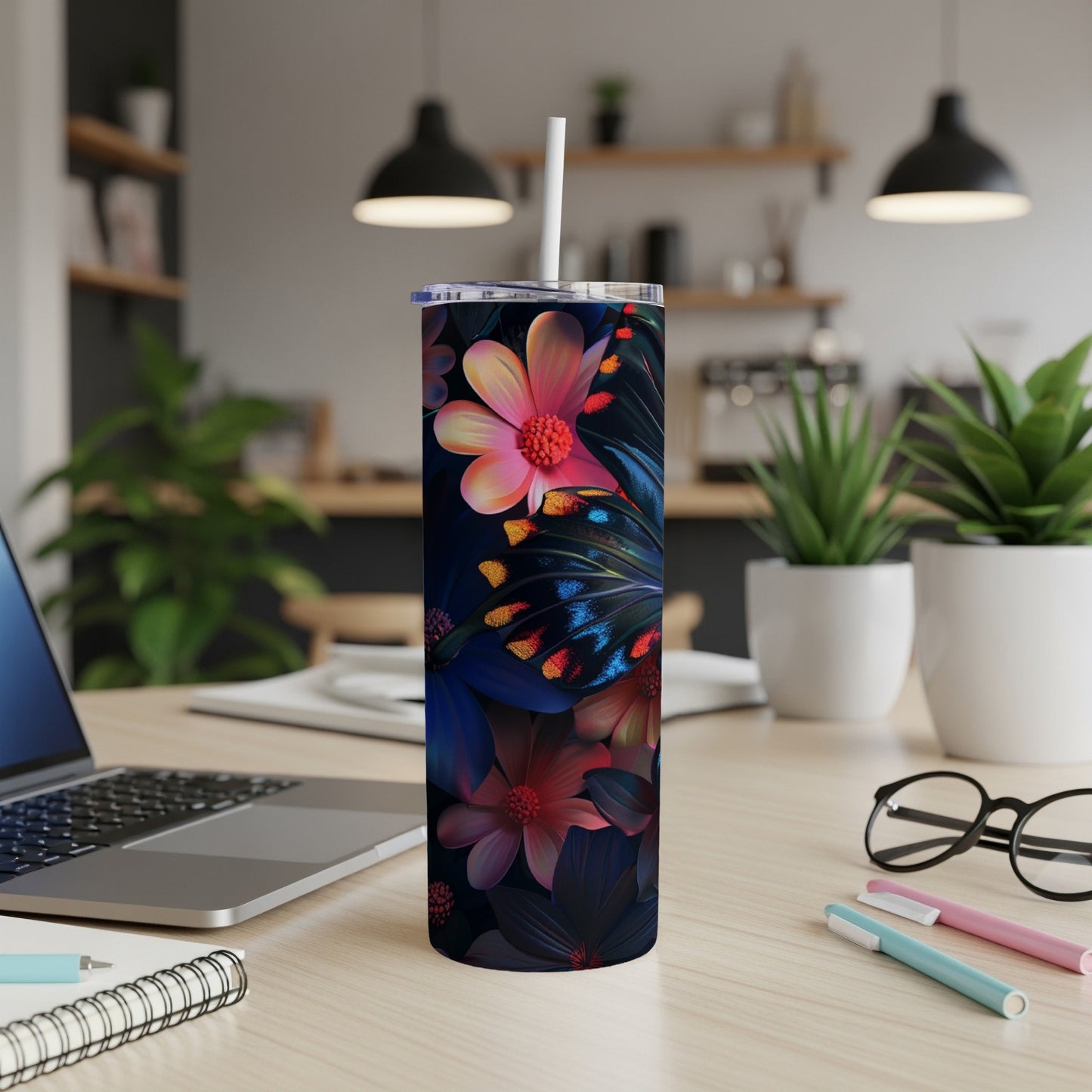Tall tumbler with a dark floral and butterfly design.