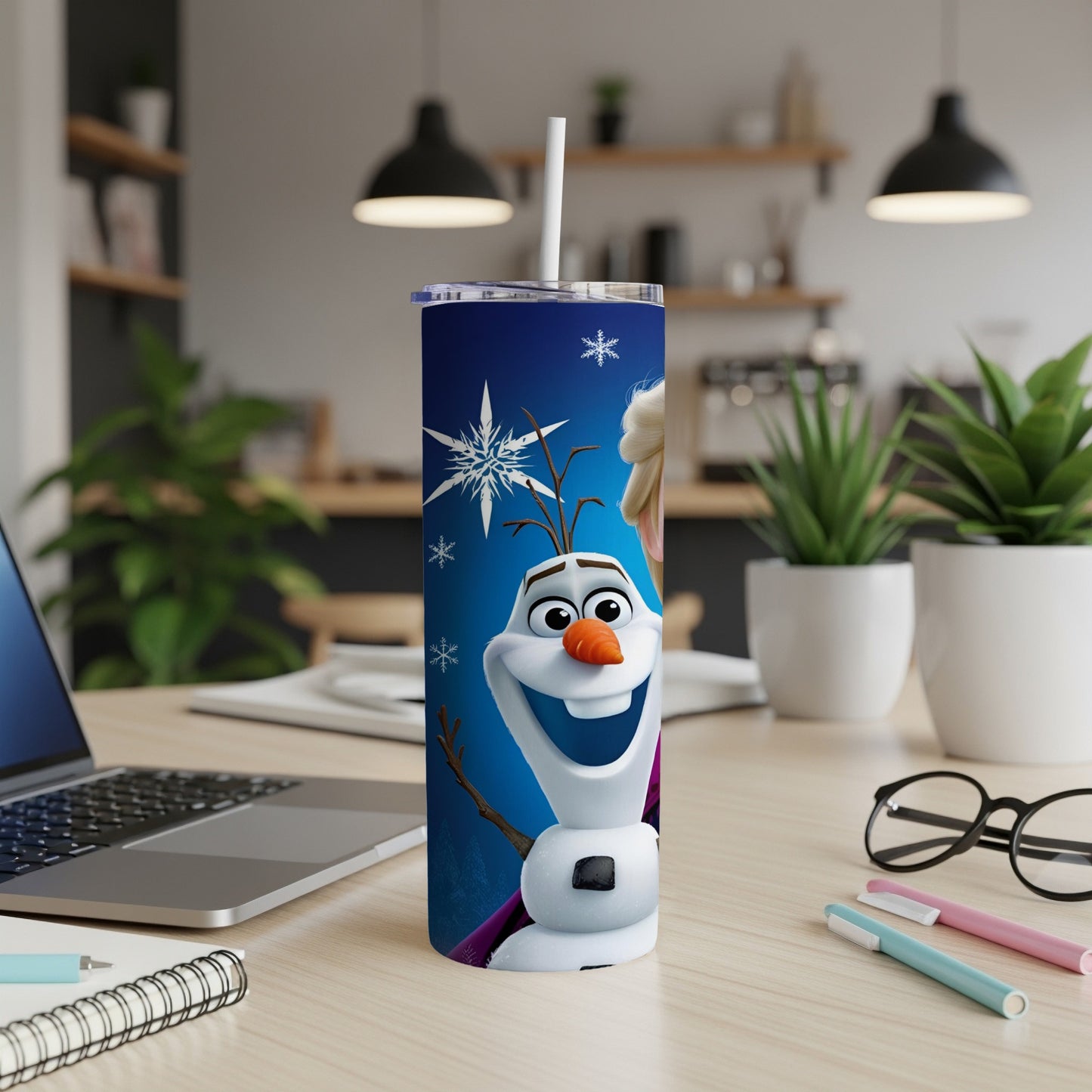 Olaf from Frozen on a blue skinny tumbler with a straw.