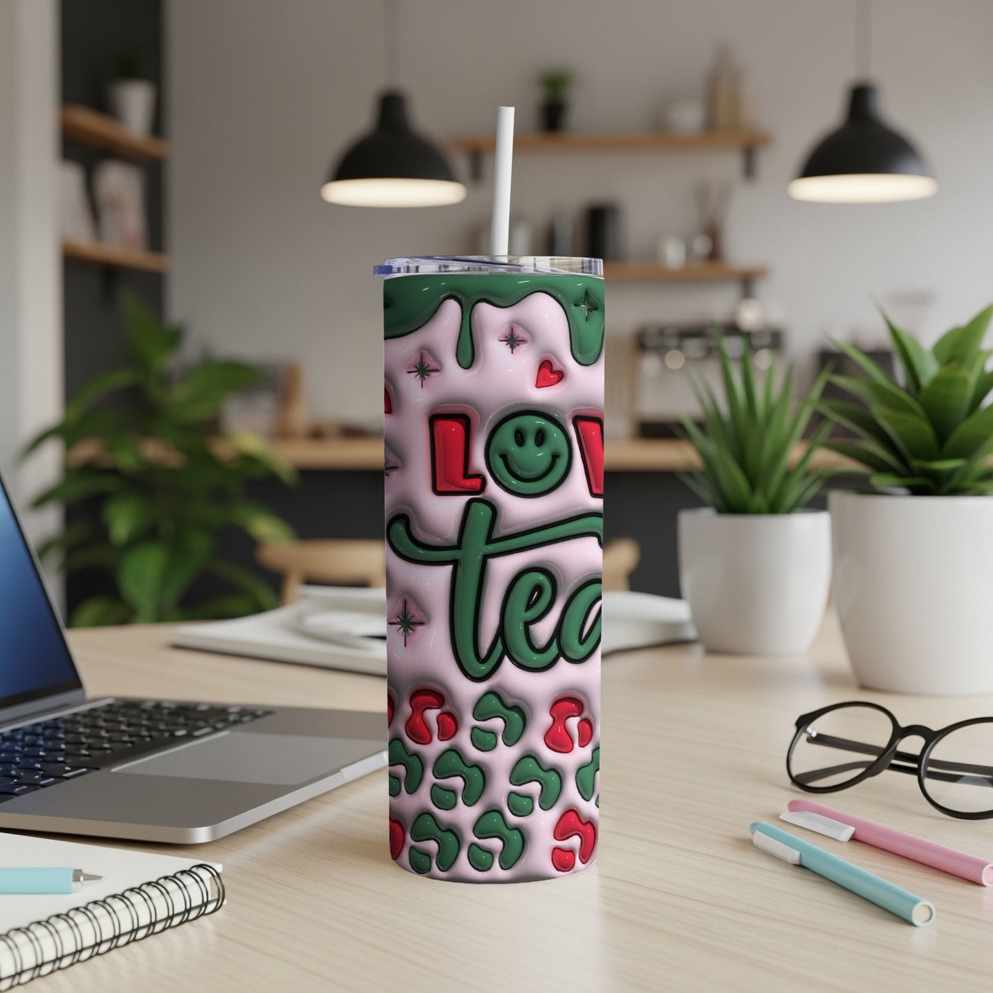 Pink tumbler with "Love You" text, green swirls, and leopard print.