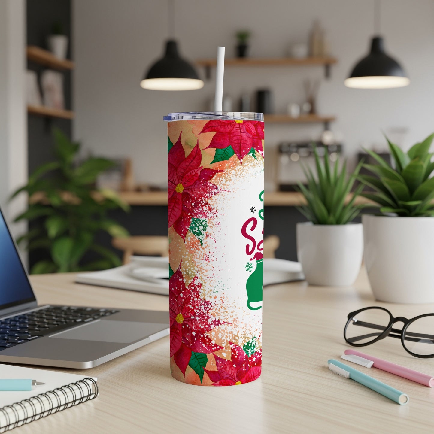 Christmas tumbler with poinsettias and "Santa's Favorite" text.