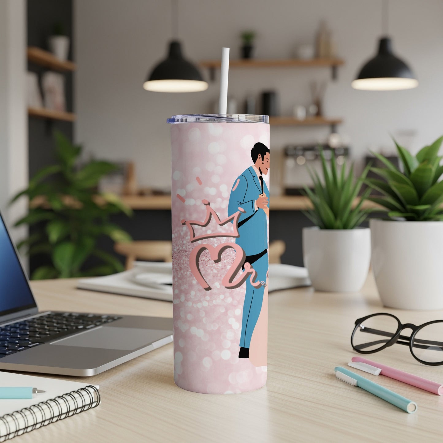 Pink tumbler with bride and groom graphic, crown, and polka dots.