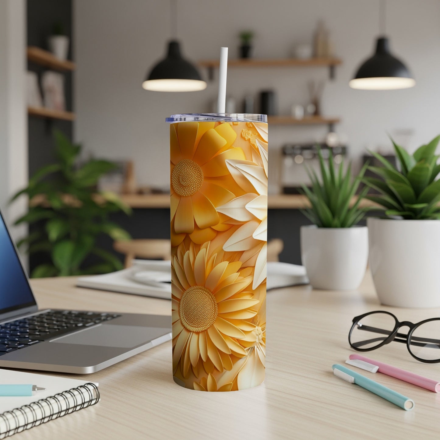 Tall tumbler with a floral pattern of yellow and white sunflowers.