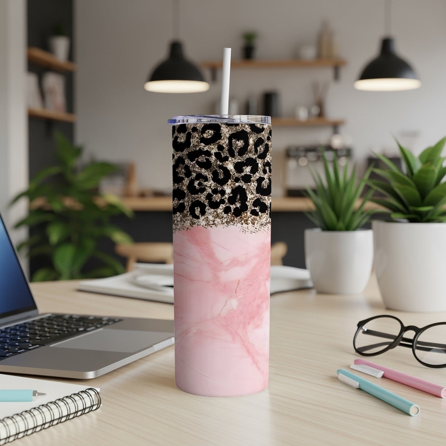 Pink marble tumbler with leopard print lid and straw.