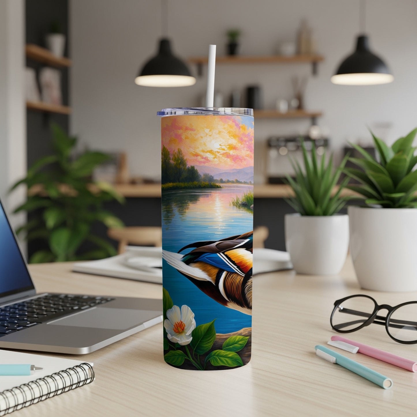 Tall tumbler with a colorful duck on a serene lake at sunset.