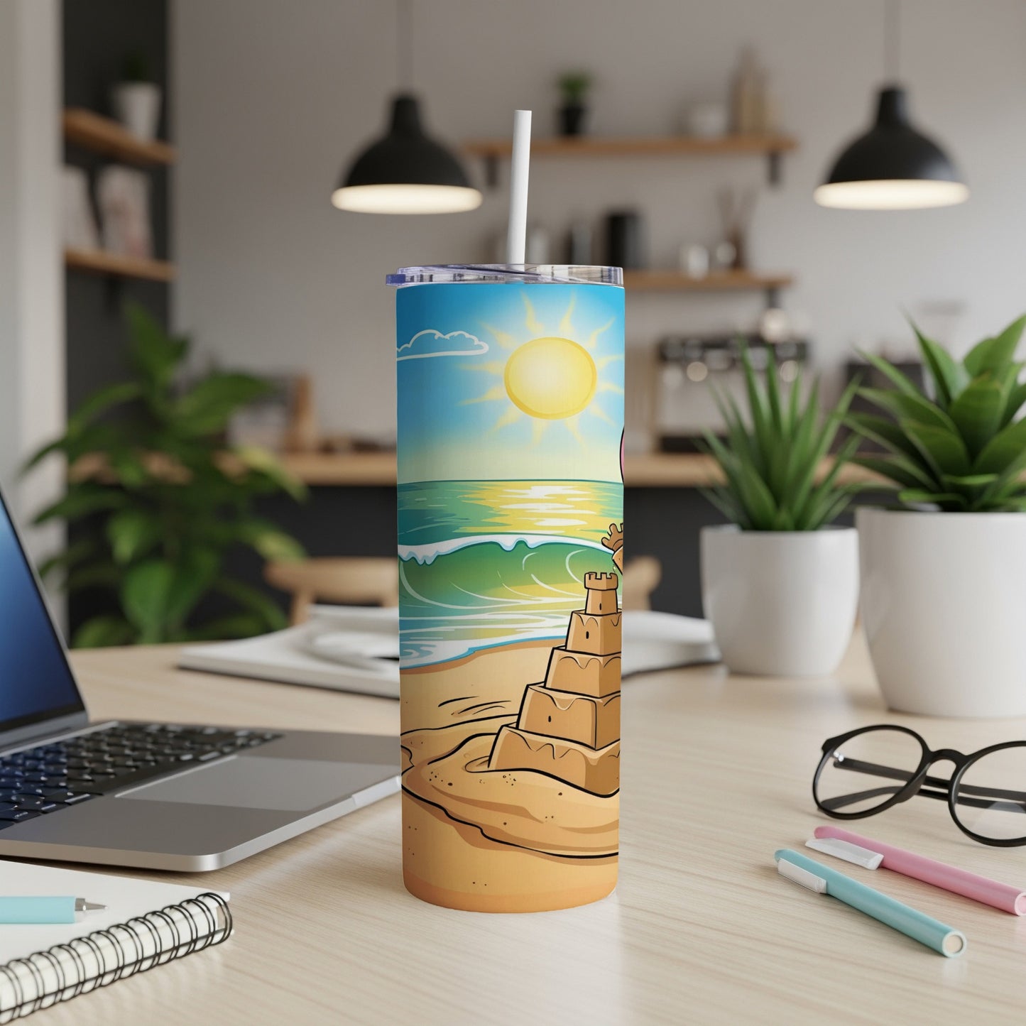 Beach scene with a sandcastle and waves on a insulated tumbler.
