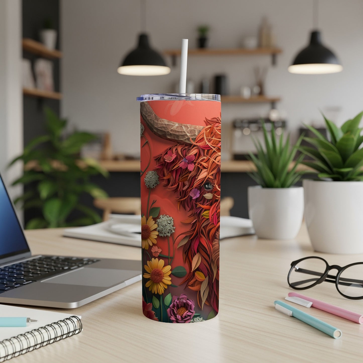 Tall tumbler with a Highland cow design and floral accents.