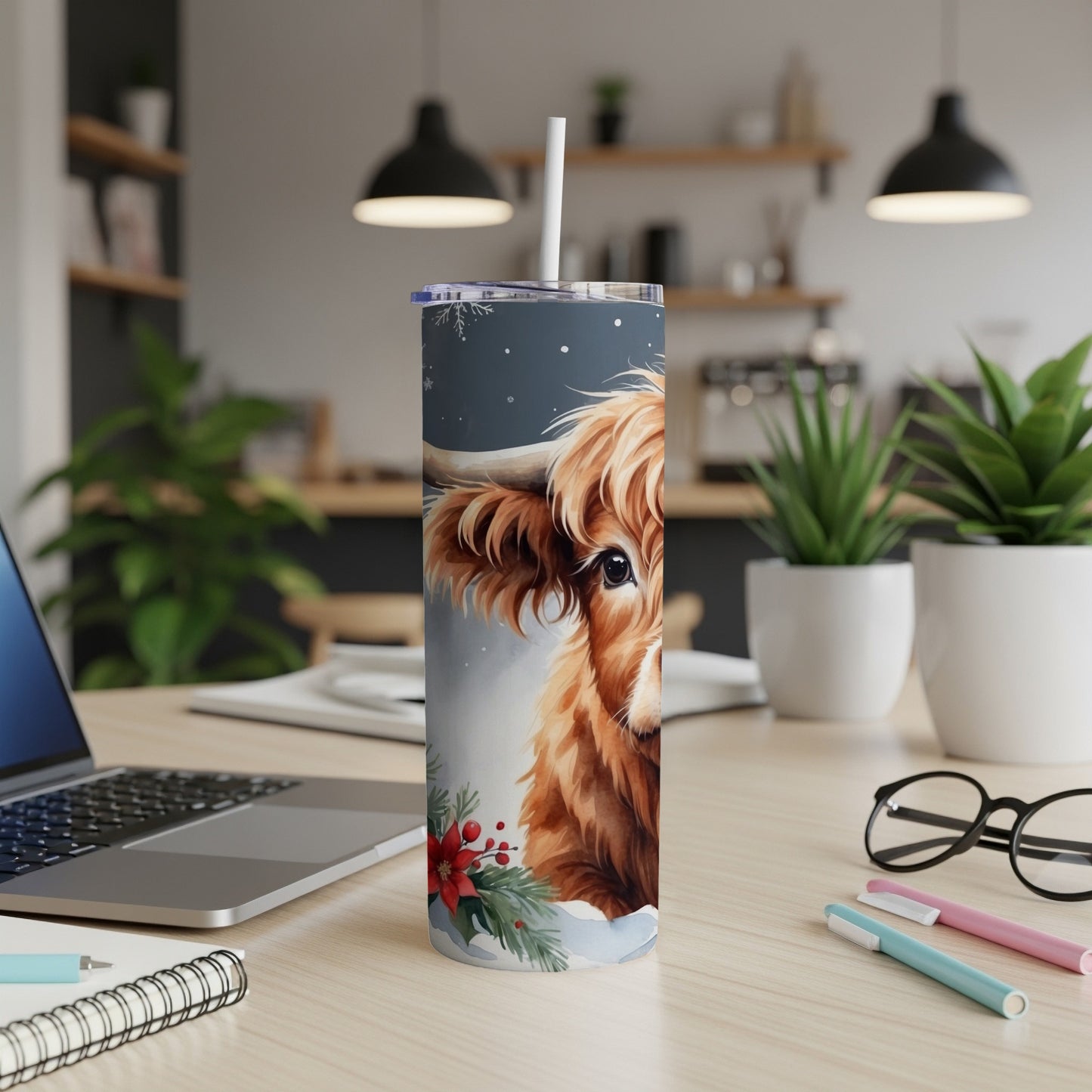 Tumbler featuring a Highland cow with snowflakes and holly.