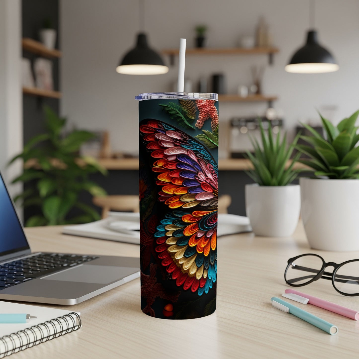 Colorful floral pattern on a tall, insulated tumbler with a straw.