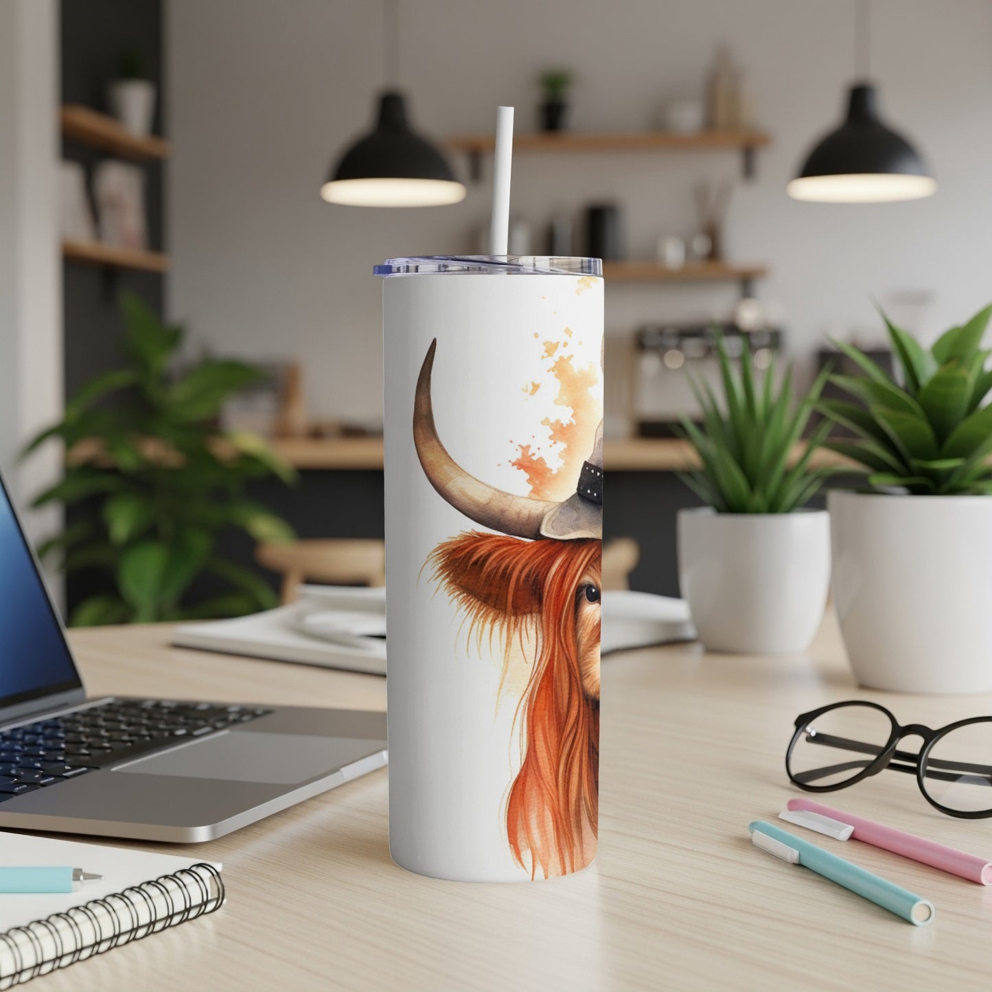 White tumbler with watercolor highland cow wearing a hat and bandana.
