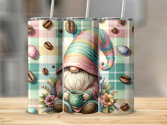 Gnome holding coffee cup surrounded by coffee beans and pastel eggs on plaid background.