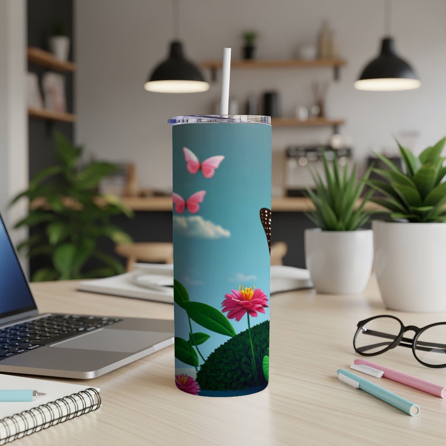Butterfly and flower design on a blue background, on a tumbler.