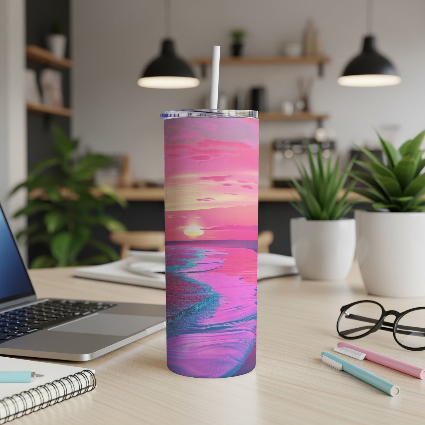 Pink and blue abstract sunset beach scene on a skinny tumbler with straw.