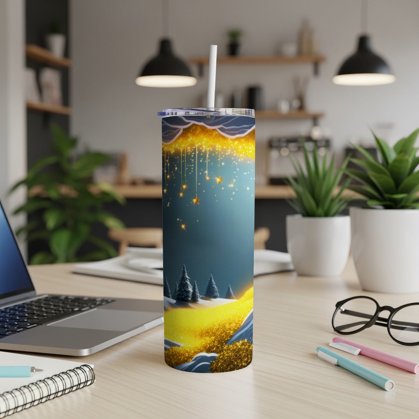 Tall tumbler with snowy landscape and gold glitter accents, against a dark blue starry sky.