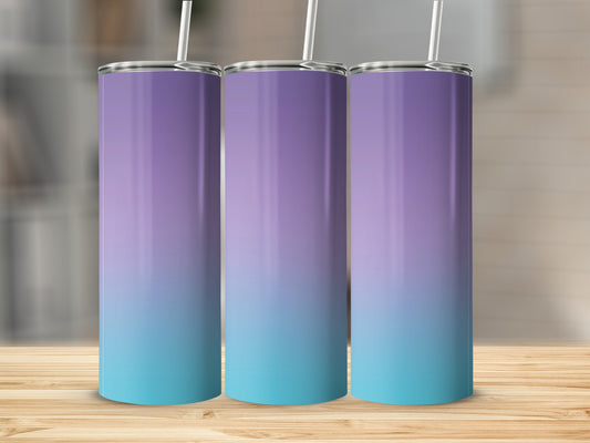 Three tumblers with a purple to teal gradient on a wooden surface.