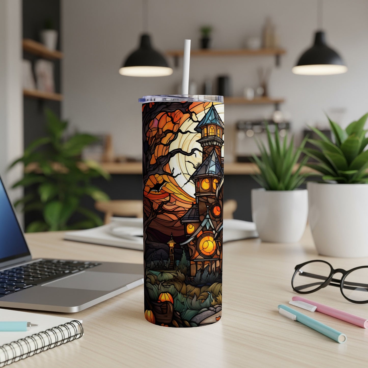 Spooky haunted house tumbler with Halloween pumpkins and fall leaves.