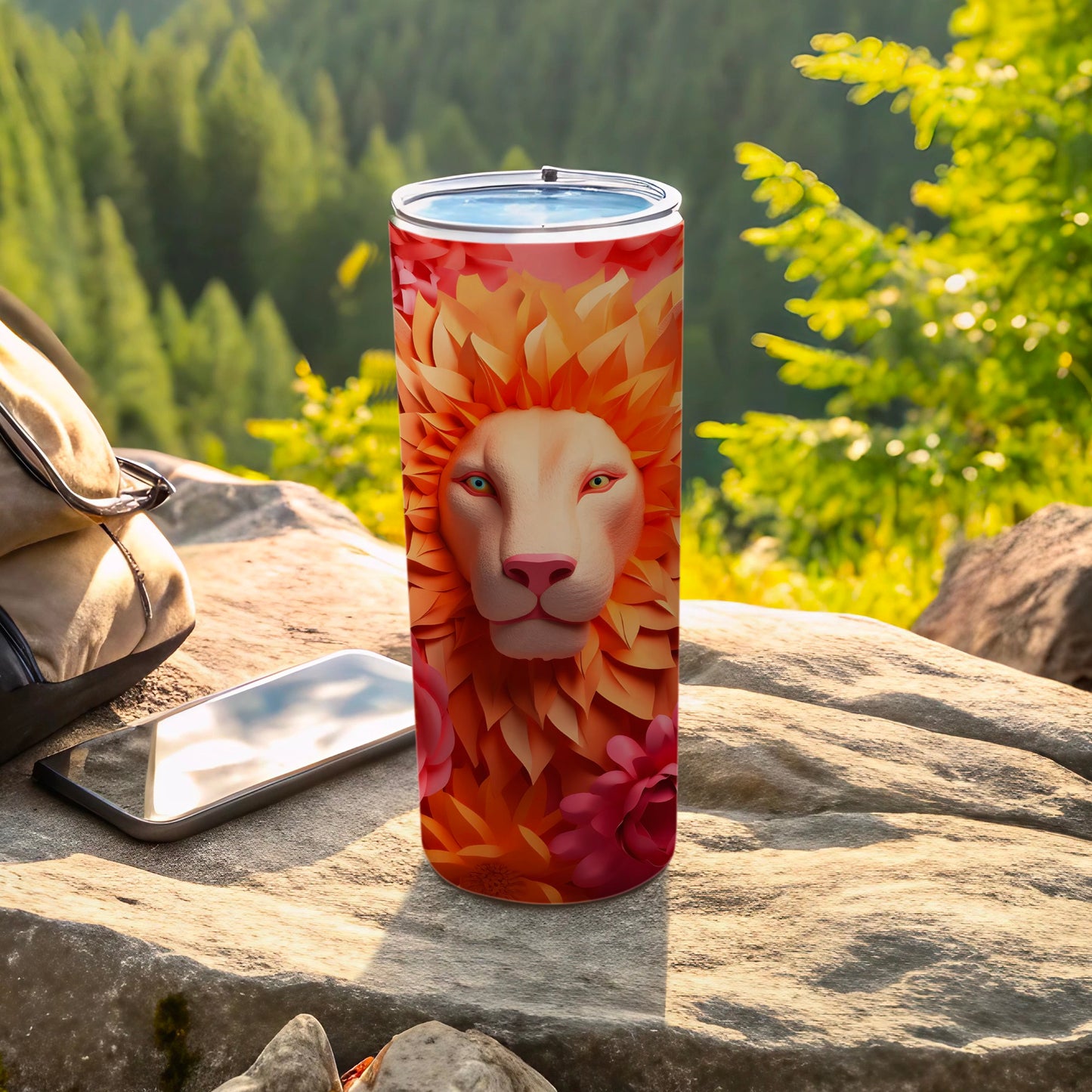Lion face design on a tumbler, with flowers and foliage.