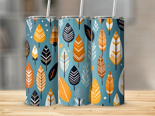 Three tumblers with a pattern of stylized leaves in orange, white, and black.