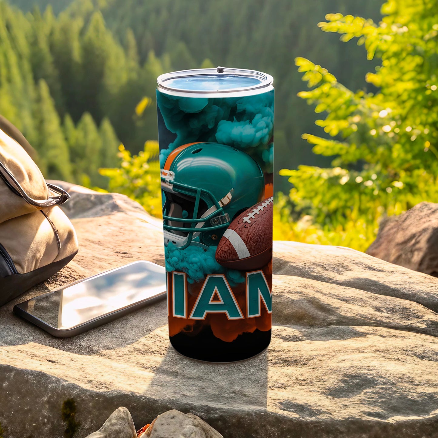 Miami Dolphins football helmet and ball on a tumbler.