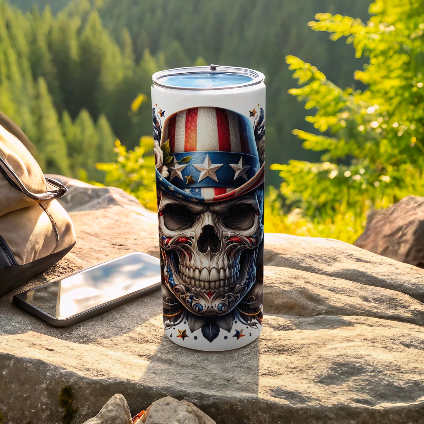 Skull tumbler with American flag hat and patriotic designs on a rock.