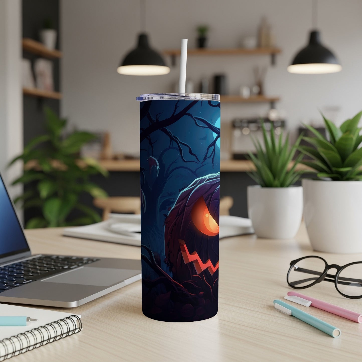 Tall tumbler with a spooky Halloween jack-o'-lantern and forest design.