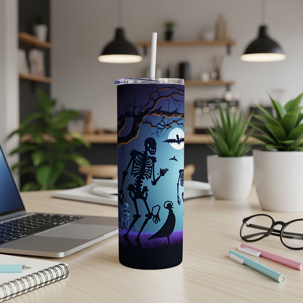 Halloween tumbler with skeleton and bat design under a full moon.