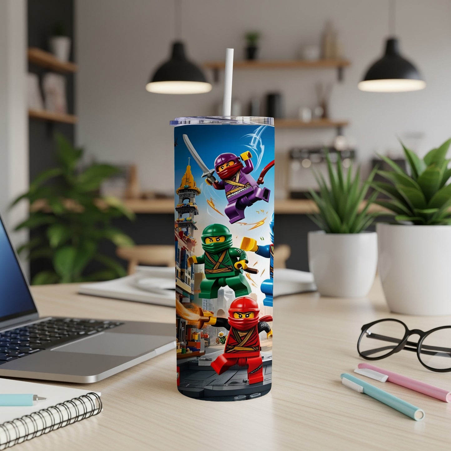 Ninjago characters in action pose on a tall tumbler in a home office setting.